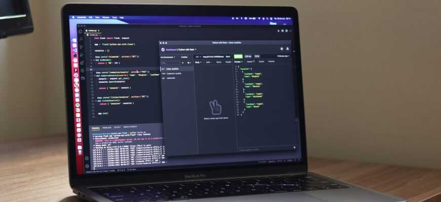 a laptop computer sitting on top of a wooden desk