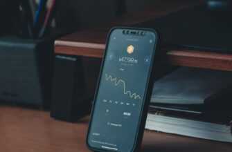 a cell phone sitting on top of a wooden desk