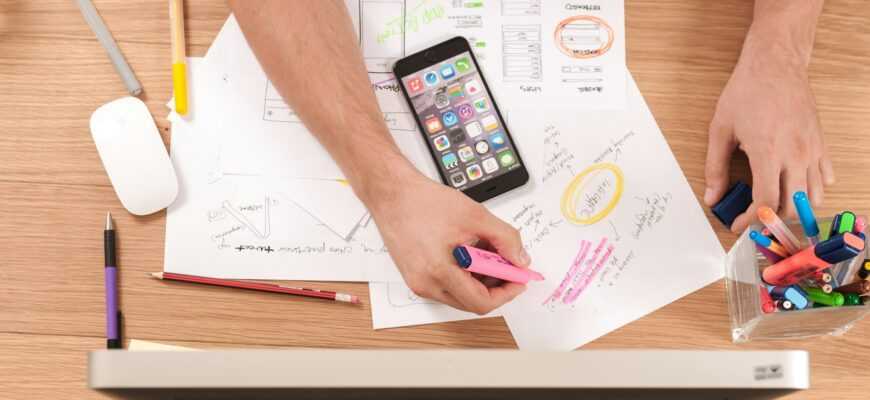 person writing on white paper