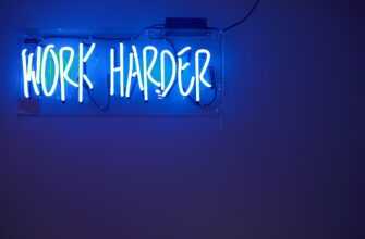 blue Work Harder neon signage
