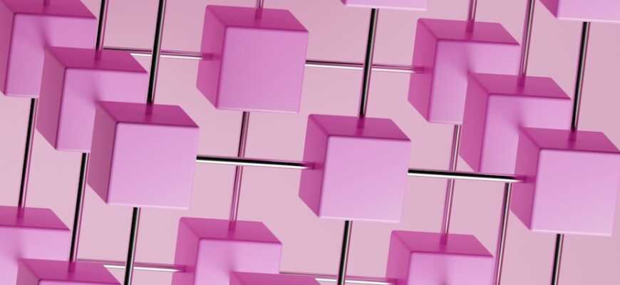 a bunch of pink cubes hanging from a pink wall