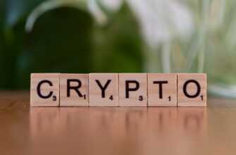 A wooden block spelling crypt on a table
