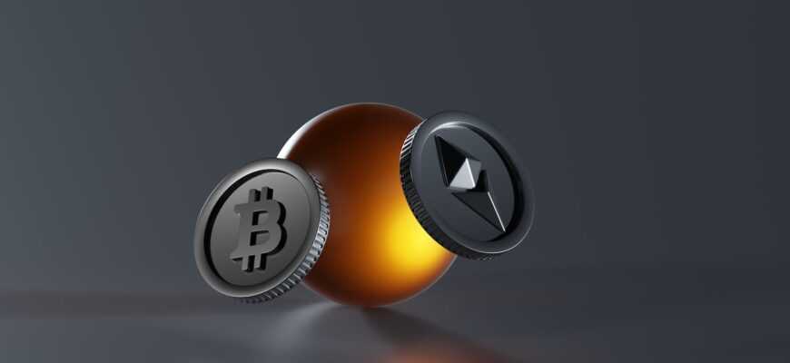 a bitcoin and a lite up coin on a table